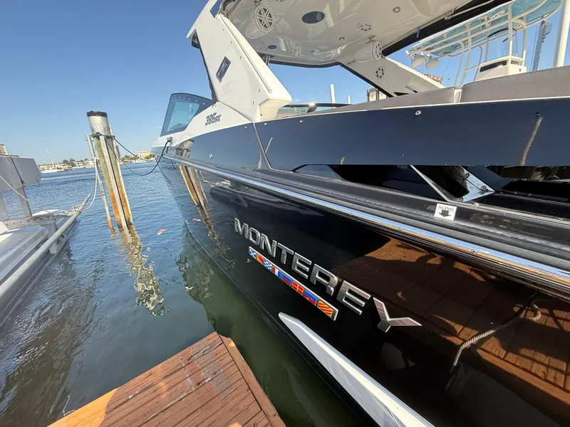 Slide: The Image of 2020 Monterey 385 Super Express boat docked at marina, side view. - 60