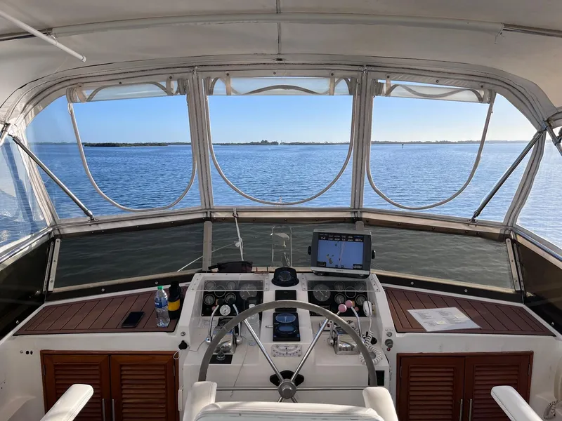 Slide: The Image of Helm of 1989 CHB Oceania 42 yacht with panoramic ocean view. - 10