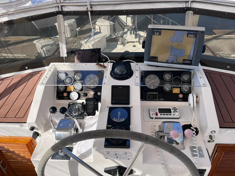 Slide: The Image of Cockpit of 1989 CHB Oceania 42 yacht with navigation instruments and steering wheel. - 13