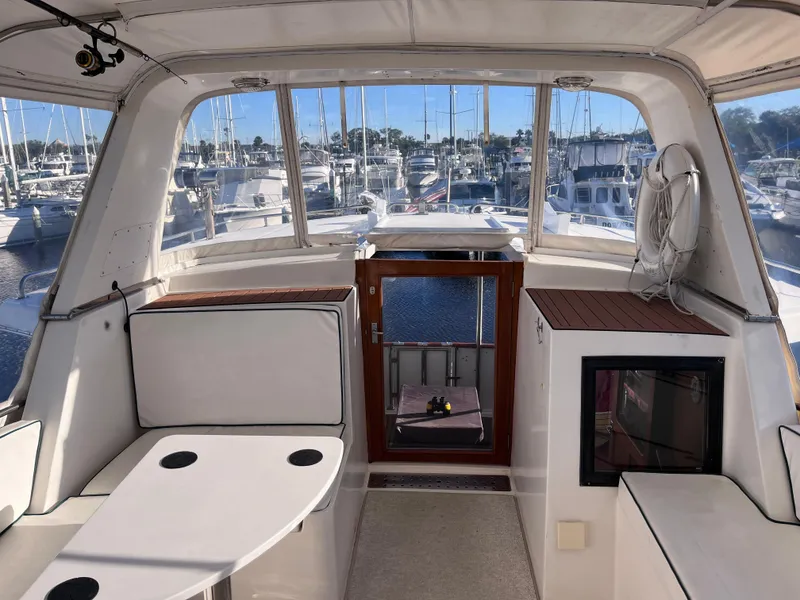 Slide: The Image of Interior view of 1989 CHB Oceania 42 yacht with marina background. - 14