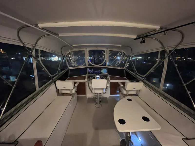 Slide: The Image of Interior view of 1989 CHB Oceania 42 yacht with seating and navigation area. - 15