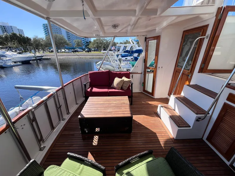 Slide: The Image of Luxurious deck of 1989 CHB Oceania 42 yacht with seating and water view. - 19