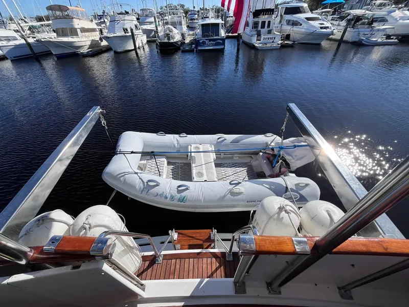 Slide: The Image of Inflatable dinghy docked behind 1989 CHB Oceania 42 yacht in marina. - 21
