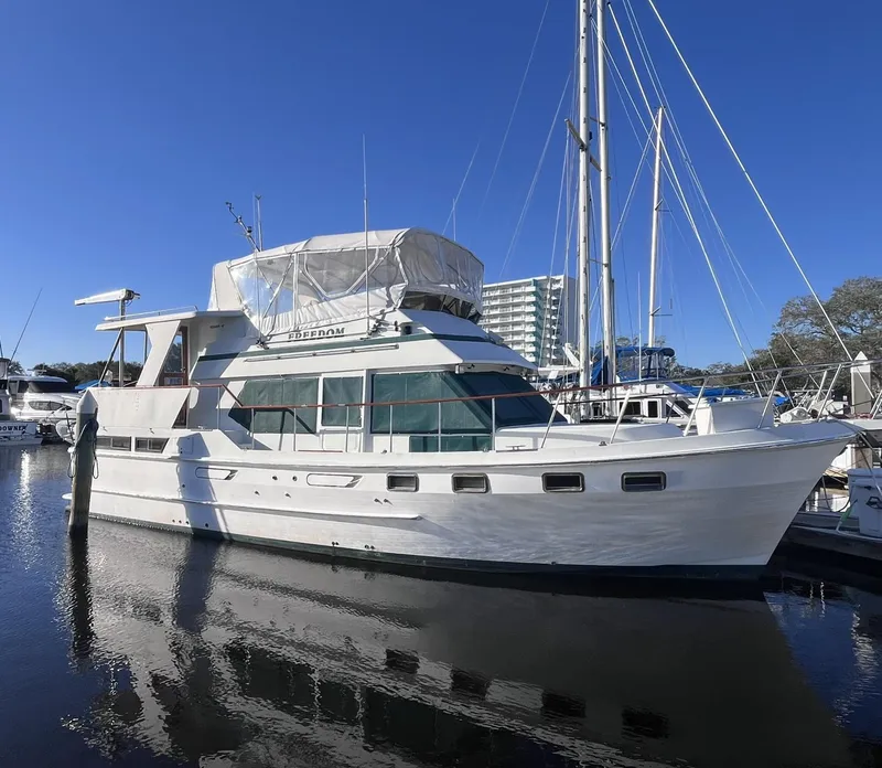 Slide: The Image of 1989 CHB Oceania 42 yacht docked in marina under clear blue sky. - 3