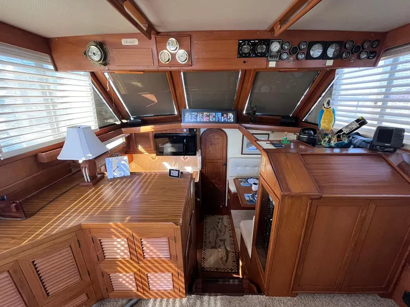 Slide: The Image of Interior of 1989 CHB Oceania 42 yacht with wooden furnishings and navigation instruments. - 37