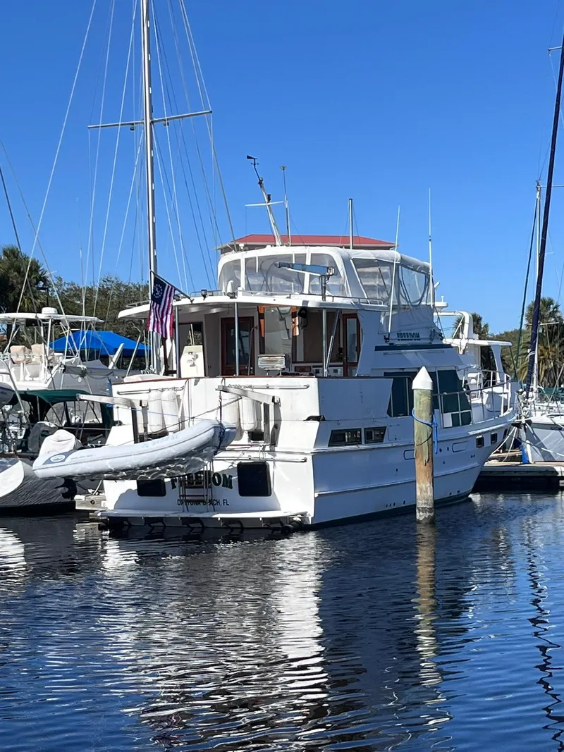 Slide: The Image of 1989 CHB Oceania 42 yacht docked at marina under clear blue sky. - 5