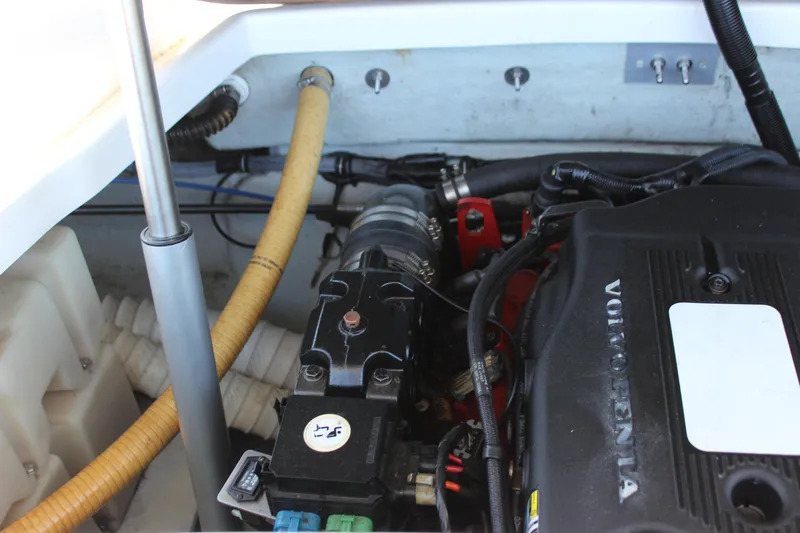 Slide: The Image of Engine compartment of a 2004 Chris-Craft Corsair 25 boat, featuring Volvo Penta components. - 32