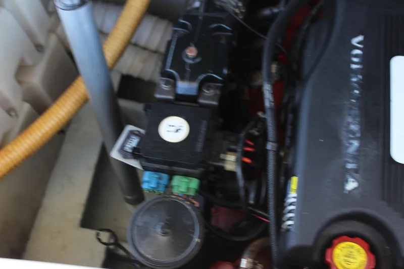 Slide: The Image of Engine compartment of a 2004 Chris-Craft Corsair 25 boat, featuring Volvo Penta components. - 35