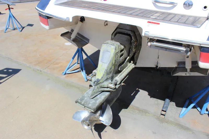 Slide: The Image of 2004 Chris-Craft Corsair 25 boat stern with propeller on stands. - 7