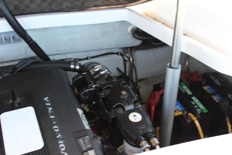 Slide: The Image of Engine compartment of a 2004 Chris-Craft Corsair 25 boat, featuring a Volvo Penta engine. - 9
