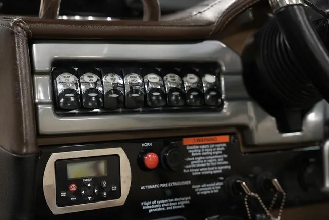 Slide: The Image of Control panel of 2016 Formula 290 Bowrider boat with switches and display. - 16