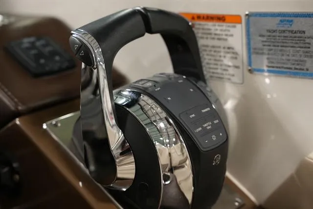 Slide: The Image of Throttle control of a 2016 Formula 290 Bowrider boat, featuring sleek design and controls. - 17