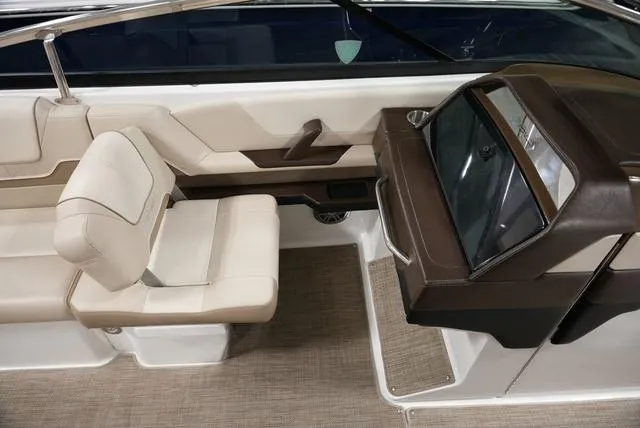 Slide: The Image of 2016 Formula 290 Bowrider interior with beige seating and sleek dashboard design. - 18