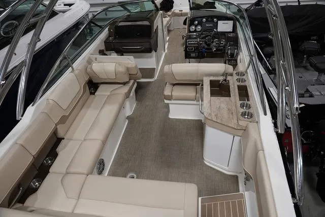 Slide: The Image of 2016 Formula 290 Bowrider interior with beige seating, modern dashboard, and spacious layout. - 8