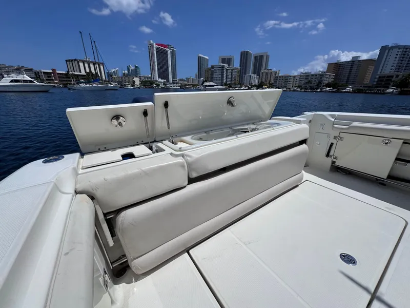 Slide: The Image of 2006 Hydra-Sports 33VX boat with open seating, city skyline in background. - 11