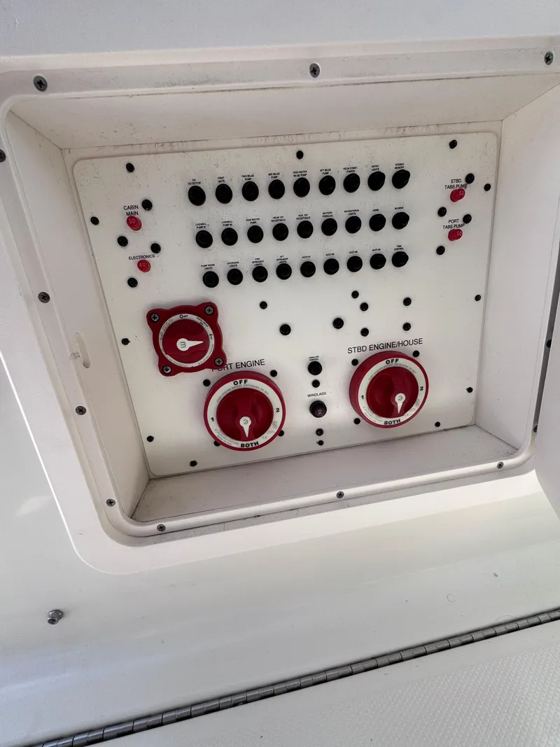 Slide: The Image of Control panel on a 2006 Hydra-Sports 33VX boat with switches and dials. - 14