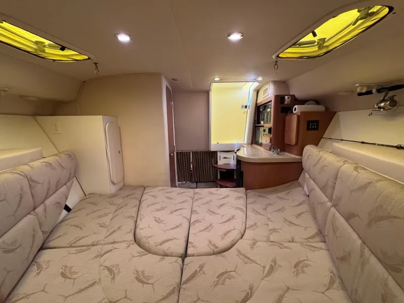 Slide: The Image of 2006 Hydra-Sports 33VX cabin interior with cozy seating and modern amenities. - 24