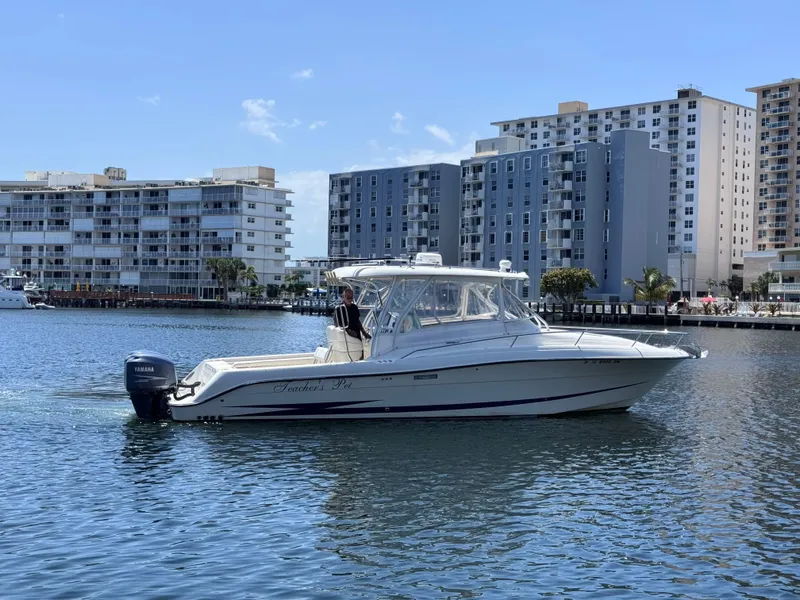 Slide: The Image of 2006 Hydra-Sports 33VX boat cruising in urban waterfront setting. - 6