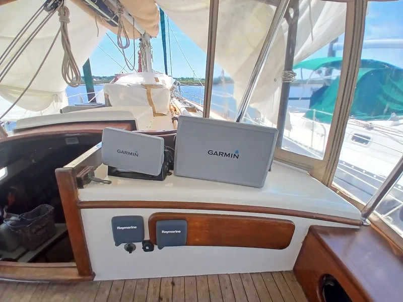 Slide: The Image of 1977 Dickerson 41 sailboat cockpit with Garmin navigation equipment. - 45