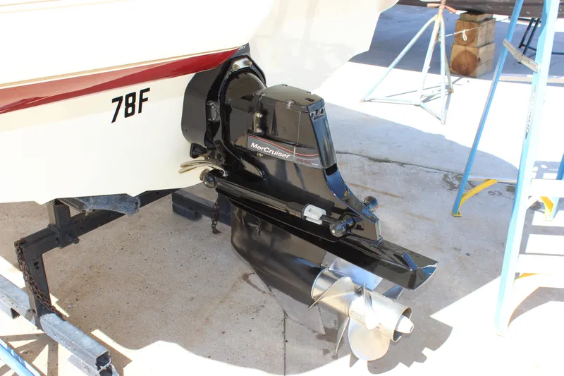 Slide: The Image of 2005 Larson LXi 268 boat with MerCruiser outdrive, docked on a trailer. - 5