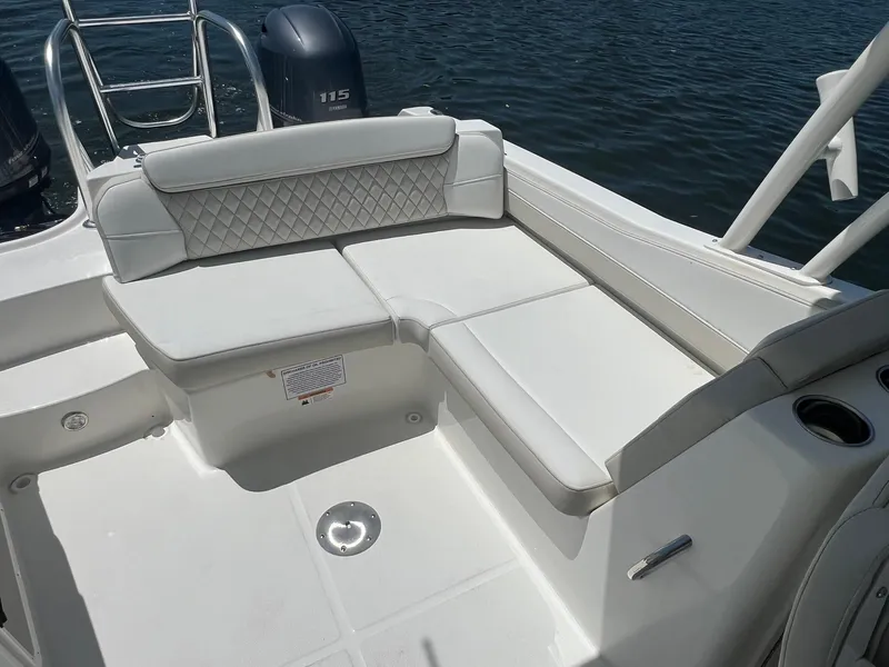 Slide: The Image of Luxury seating on 2025 World Cat 230 SD boat, featuring white upholstery and diamond stitching. - 12