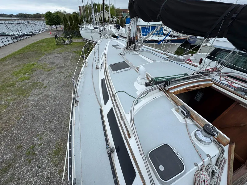 Slide: The Image of Catalina 42 MkII sailboat, 1989 model, docked with visible deck and rigging. - 13