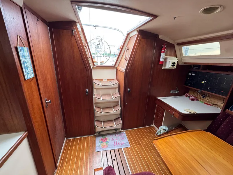 Slide: The Image of Interior of a 1989 Catalina 42 MkII sailboat with wooden finishes and navigation station. - 17