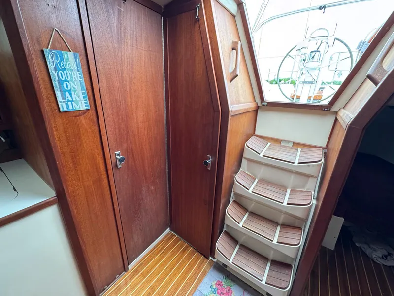 Slide: The Image of Interior of 1989 Catalina 42 MkII sailboat with wooden stairs and doors. - 26