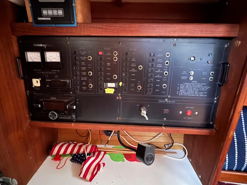Slide: The Image of Electrical panel of a 1989 Catalina 42 MkII sailboat with American flag decor. - 32