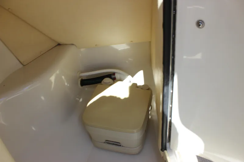 Slide: The Image of Interior of 2001 Sea Ray 260 Sundeck with portable toilet. - 20