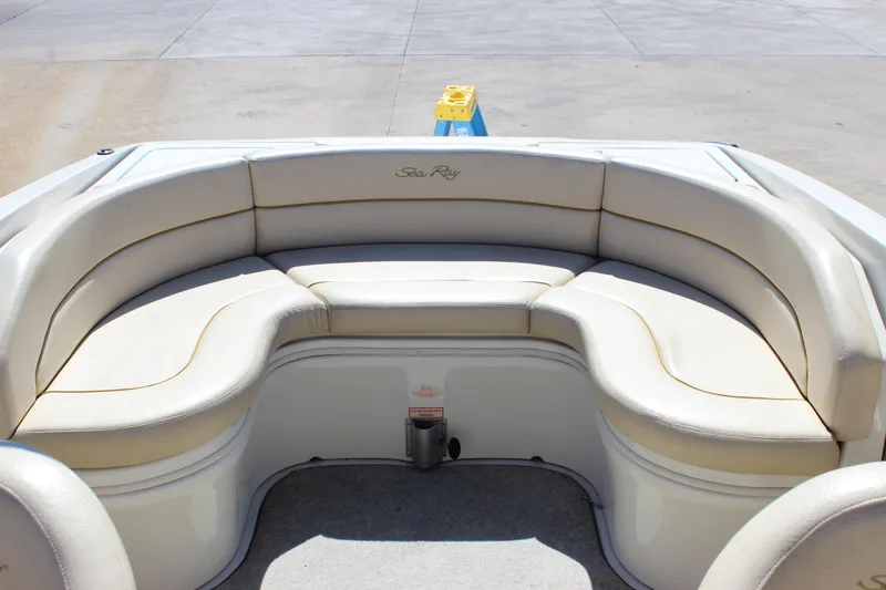 Slide: The Image of 2001 Sea Ray 260 Sundeck boat with spacious, curved seating area. - 23