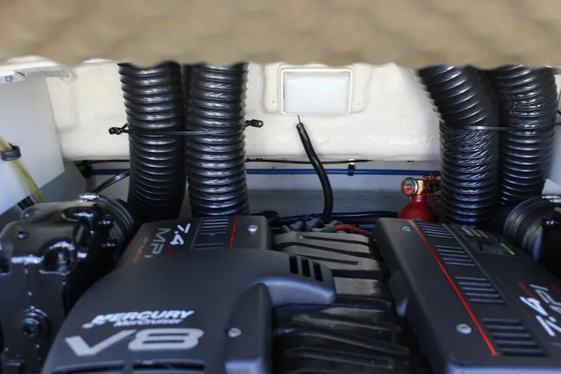 Slide: The Image of Engine compartment of a 2001 Sea Ray 260 Sundeck with Mercury V8 engines. - 28