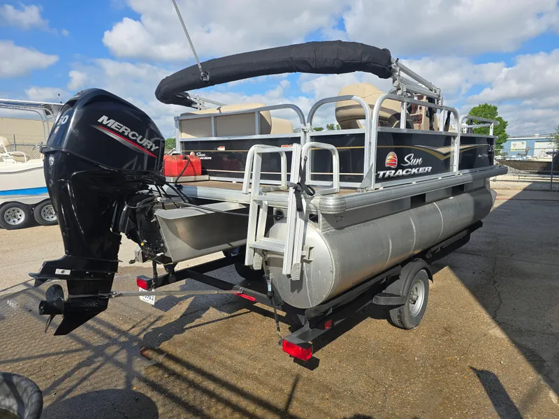 Slide: The Image of 2021 Sun Tracker Bass Buggy 16 DLX pontoon boat with Mercury outboard motor. - 4