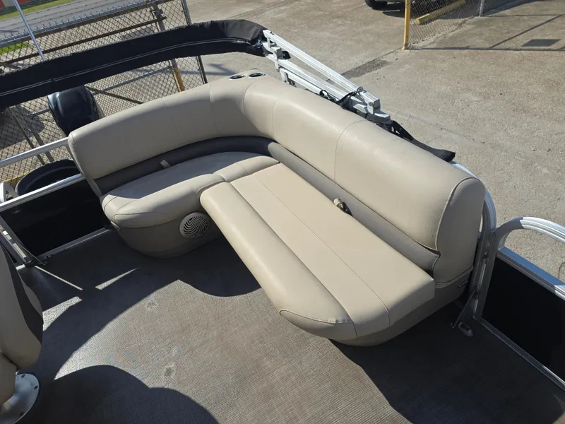 Slide: The Image of 2021 Sun Tracker Bass Buggy 16 DLX pontoon boat with beige seating. - 6