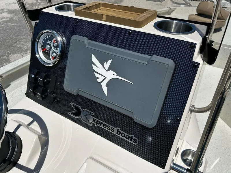 Slide: The Image of Control panel of 2025 Xpress H22B boat with logo and gauges. - 8