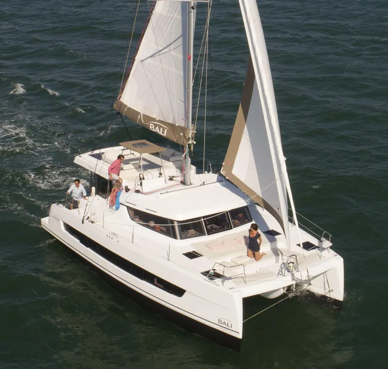 The Image of 2026 Bali CATSPACE catamaran sailing on open water with passengers on deck. - 0