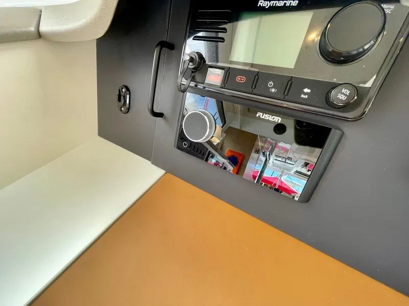 Slide: The Image of Control panel of 2026 Bali CATSPACE yacht featuring Raymarine and Fusion systems. - 11