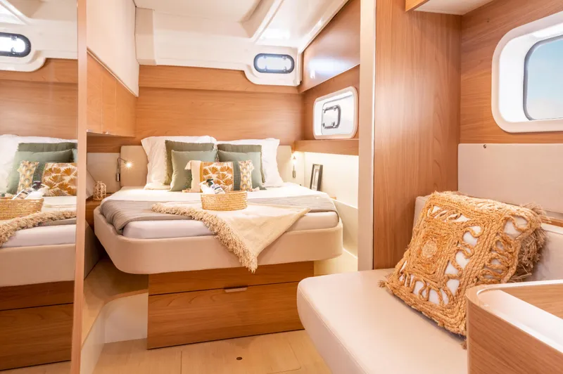 Slide: The Image of Luxurious interior of 2026 Bali CATSPACE yacht with cozy bedroom and elegant decor. - 13
