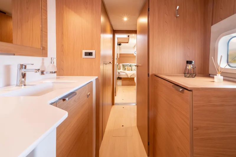 Slide: The Image of Modern interior of 2026 Bali CATSPACE yacht with wooden cabinetry and sleek design. - 14