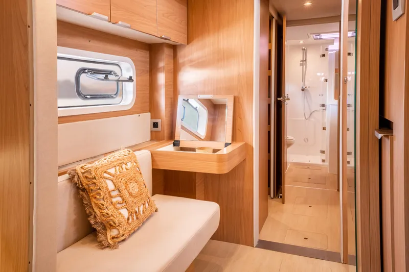 Slide: The Image of Luxurious interior of 2026 Bali CATSPACE yacht with elegant wood finish and modern amenities. - 16