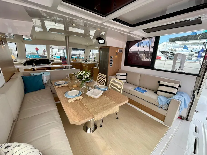 Slide: The Image of Luxurious interior of 2026 Bali CATSPACE catamaran with elegant dining area and modern decor. - 2