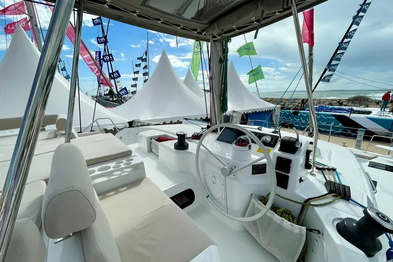 Slide: The Image of 2026 Bali CATSPACE yacht helm with modern controls and comfortable seating at a marina. - 22