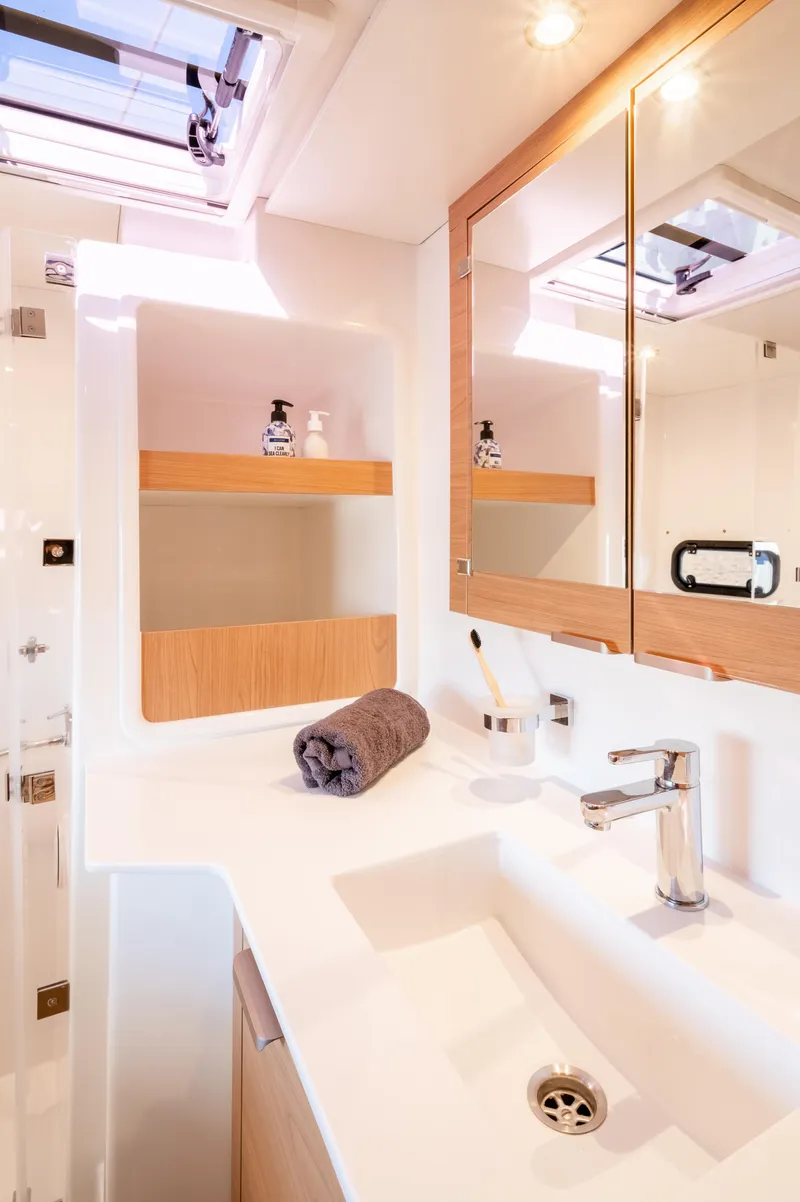 Slide: The Image of Modern bathroom in 2026 Bali CATSPACE yacht with sleek fixtures and wooden accents. - 23