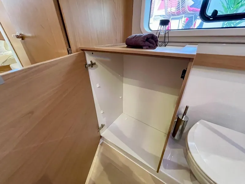 Slide: The Image of Modern bathroom in 2026 Bali CATSPACE yacht with open cabinet and window view. - 25