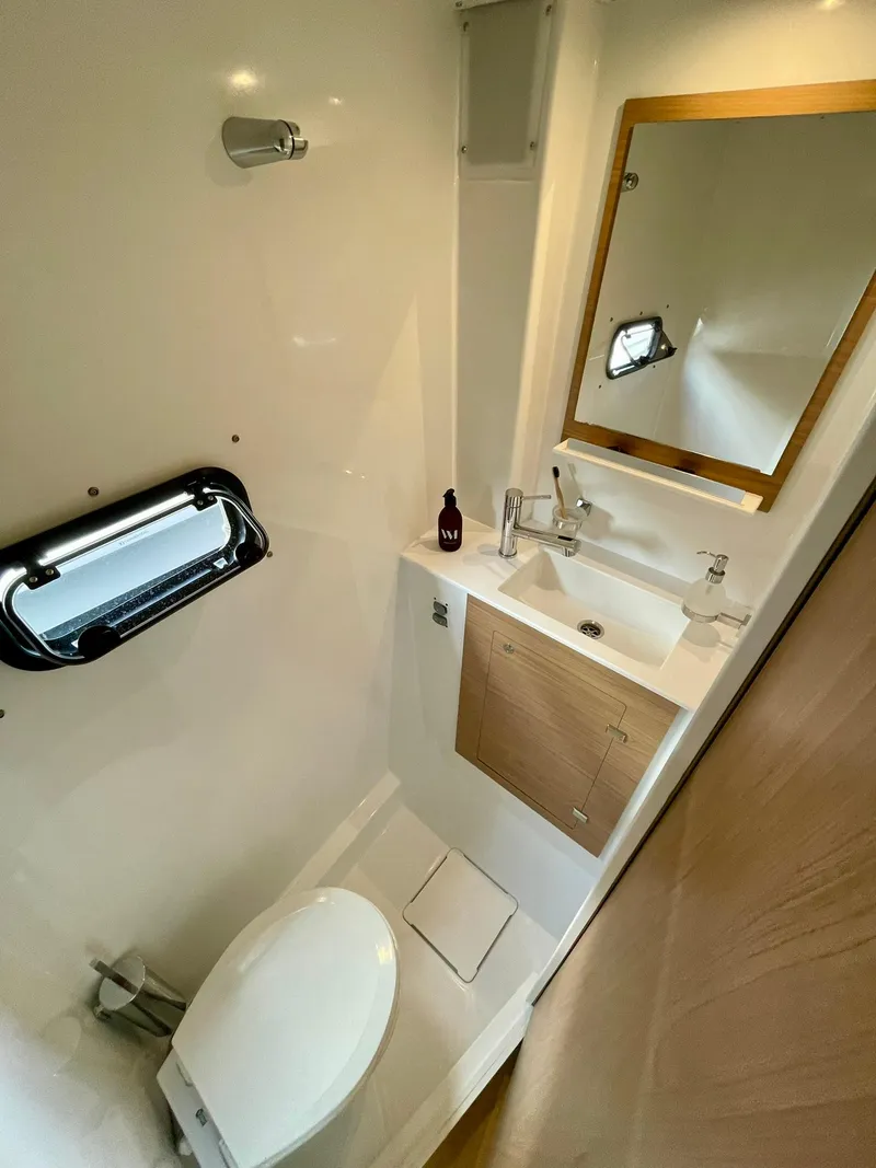 Slide: The Image of Modern bathroom in 2026 Bali CATSPACE yacht with sink, mirror, and toilet. - 29