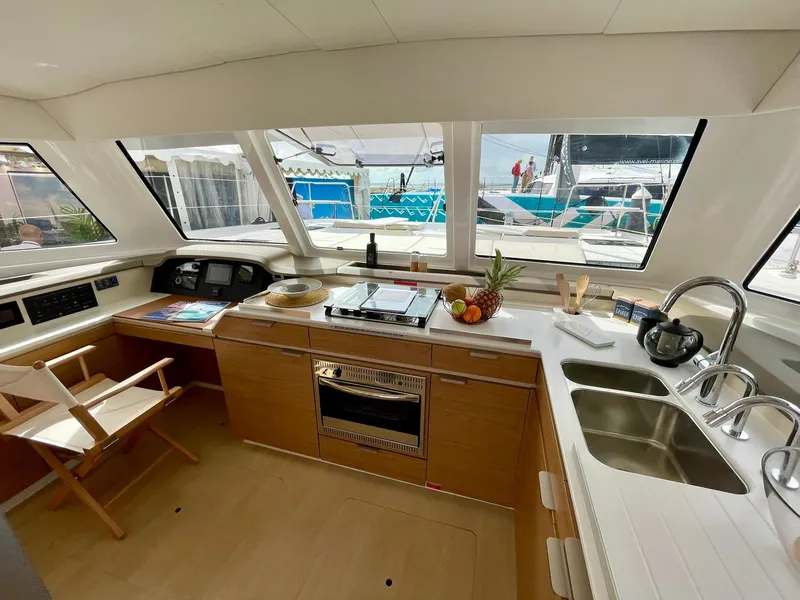 Slide: The Image of Modern kitchen interior of 2026 Bali CATSPACE yacht with panoramic windows and sleek design. - 3