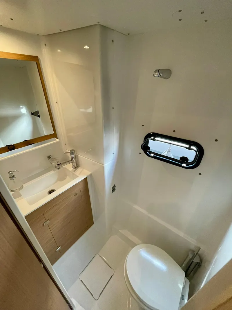 Slide: The Image of Modern bathroom in 2026 Bali CATSPACE yacht with sink, toilet, and window. - 30