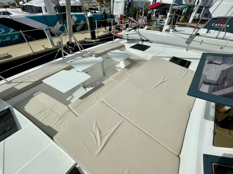 Slide: The Image of Luxurious 2026 Bali CATSPACE catamaran with spacious sunbathing area and modern design at a marina. - 34