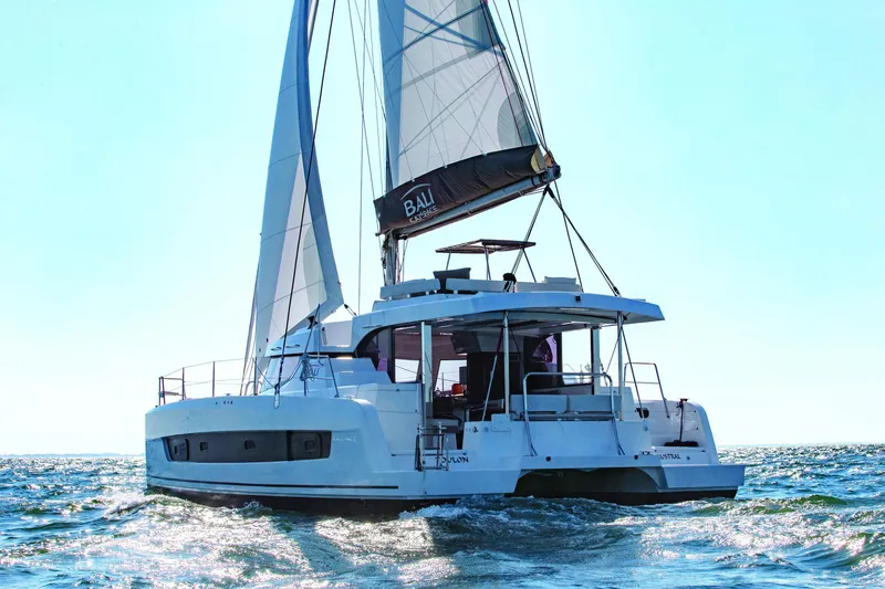 Slide: The Image of 2026 Bali CATSPACE catamaran sailing on open water under clear skies. - 36