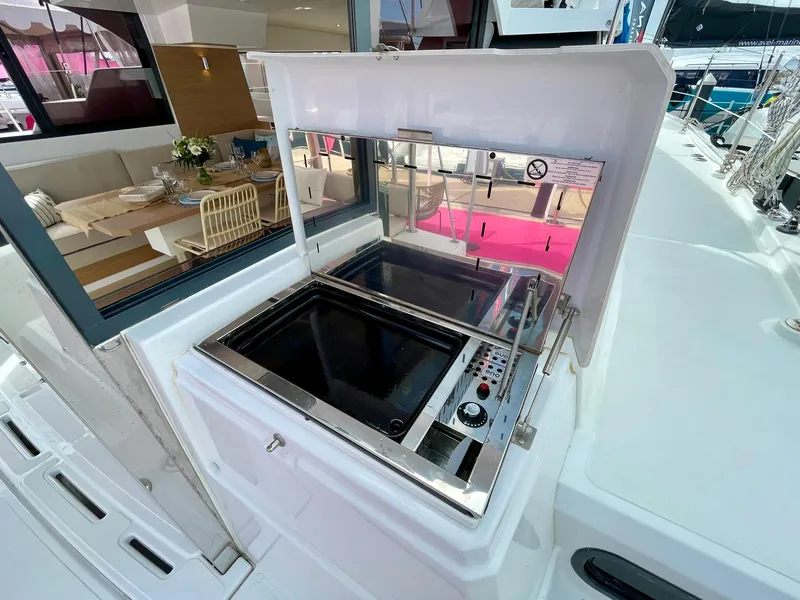 Slide: The Image of Outdoor kitchen on 2026 Bali CATSPACE yacht with modern grill and dining area. - 38